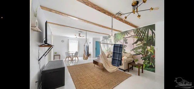 a kitchen with kitchen island wooden floor and refrigerator