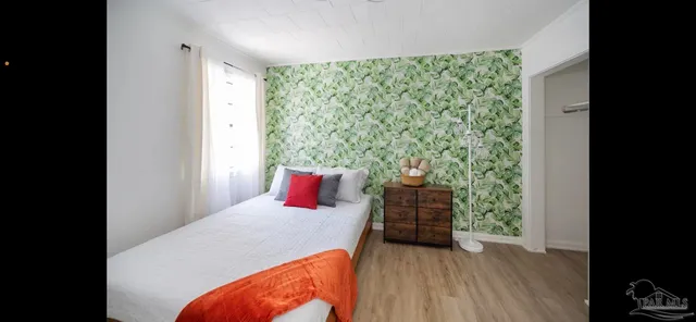 a room with furniture and a flat screen tv