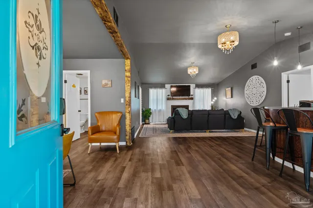 an aerial view of residential house with outdoor space and trees all around