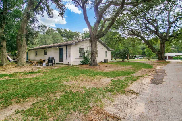 a view of a park with swings and trees