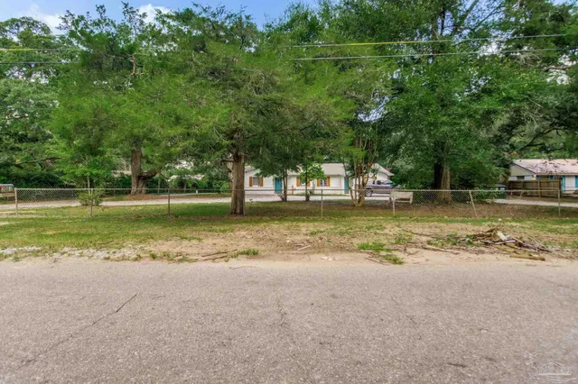 a view of a park with swings and trees
