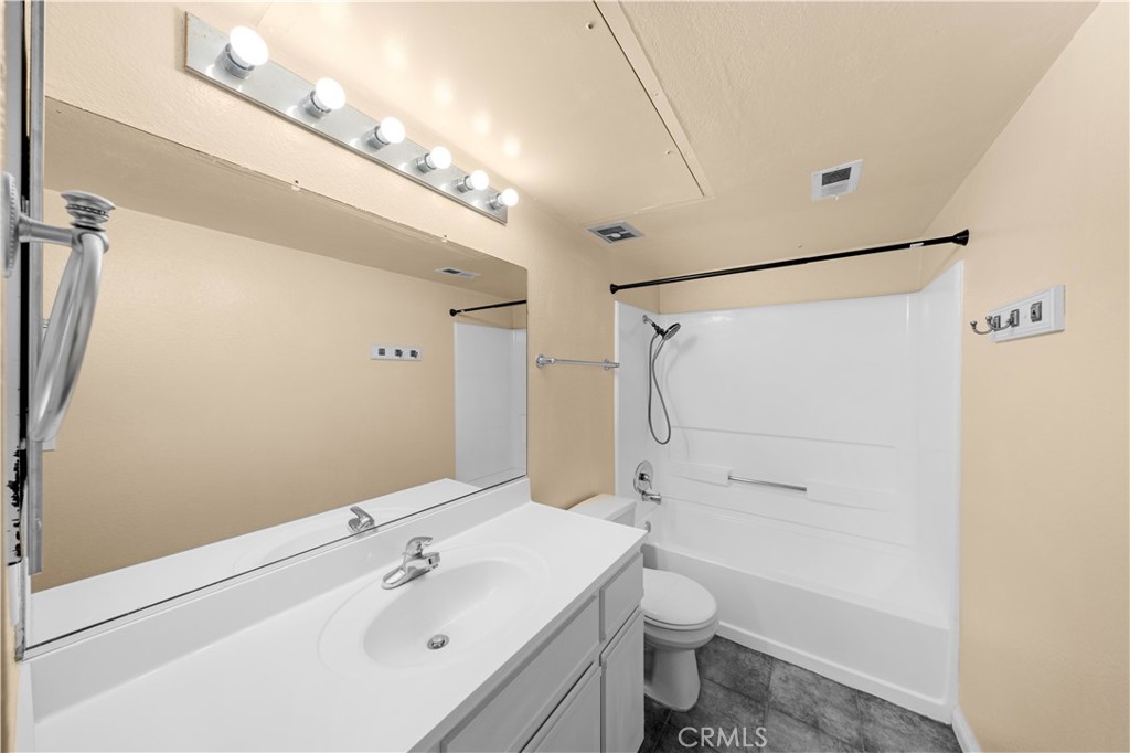10655 Lemon Avenue, Unit 1710 Rancho Cucamonga, CA 91737 - Photo 4 of 13 a bathroom with a sink a toilet and shower
