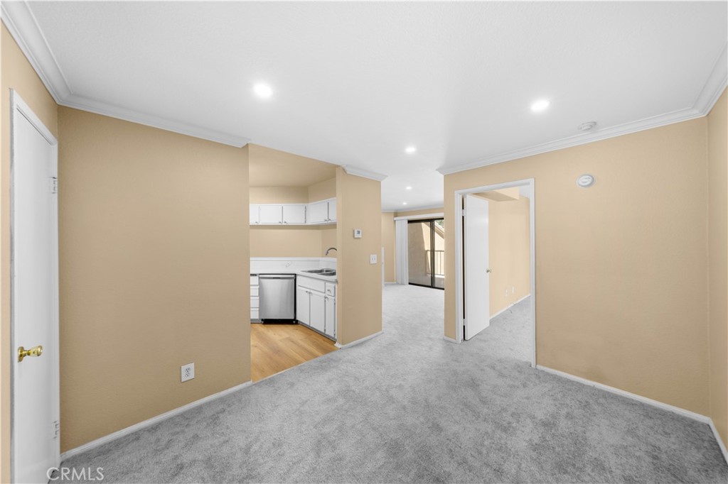 10655 Lemon Avenue, Unit 1710 Rancho Cucamonga, CA 91737 - Photo 5 of 13 a view of a kitchen with a sink and a refrigerator