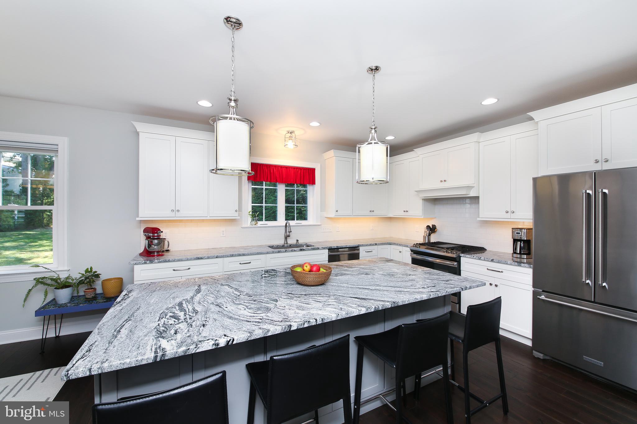 111 Gallagher Road Wayne, PA 19087 - Photo 9 of 31 Kitchen island has 4-person seating