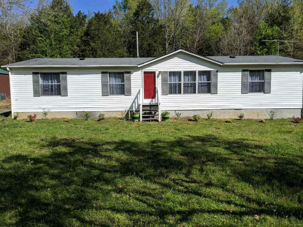 4305 Chicken Road Lebanon, TN 37090 - Photo 1 of 28 a front view of a house with a yard