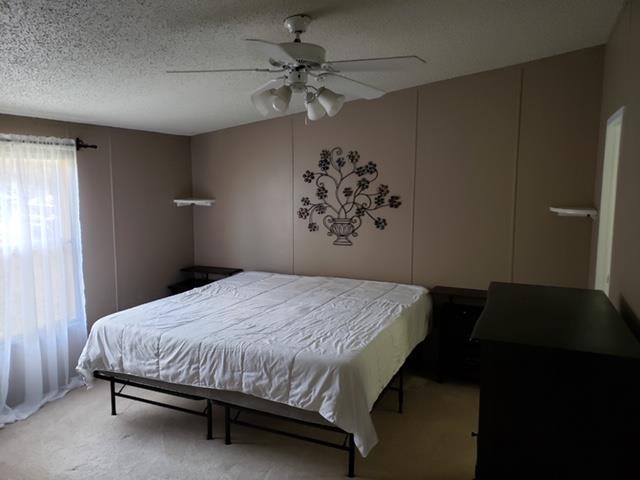 4305 Chicken Road Lebanon, TN 37090 - Photo 8 of 28 a bedroom with a bed and a chandelier