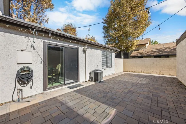 a view of a house with a small yard