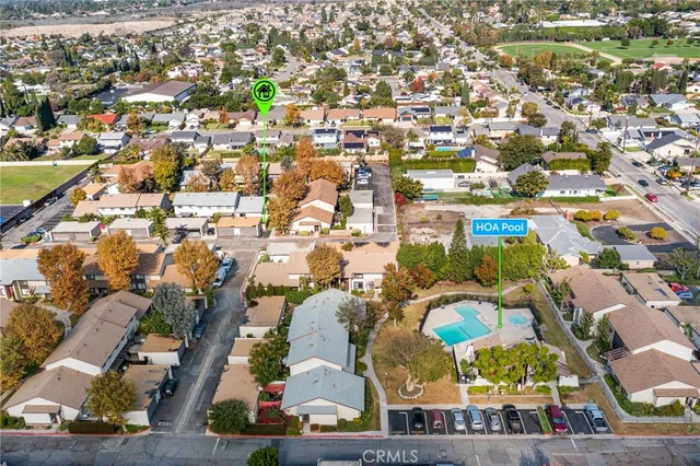 an aerial view of residential houses with outdoor space