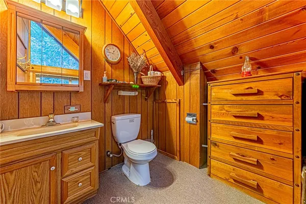 a backyard of a house with barbeque oven table and chairs