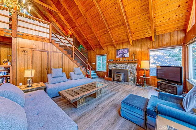 a view of a patio with table and chairs with wooden floor and fence
