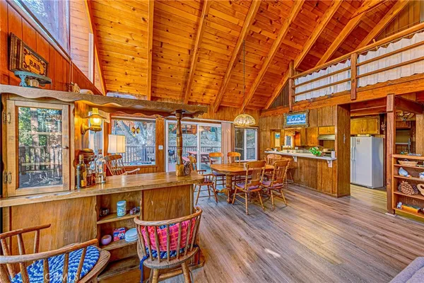 a view of a big dining room with furniture window and wooden floor