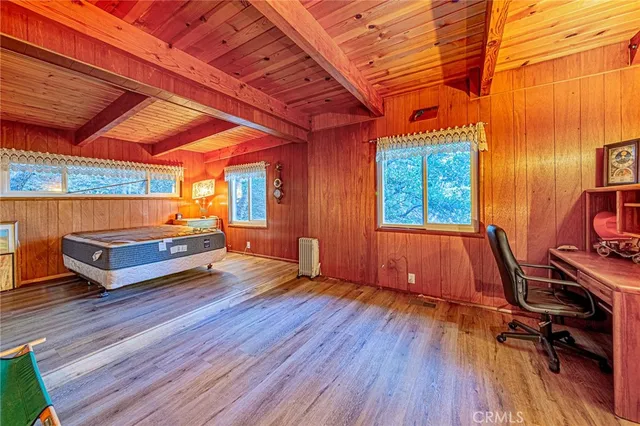 a bedroom with furniture and a window