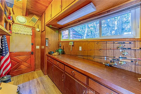 a view of a house with a deck and furniture