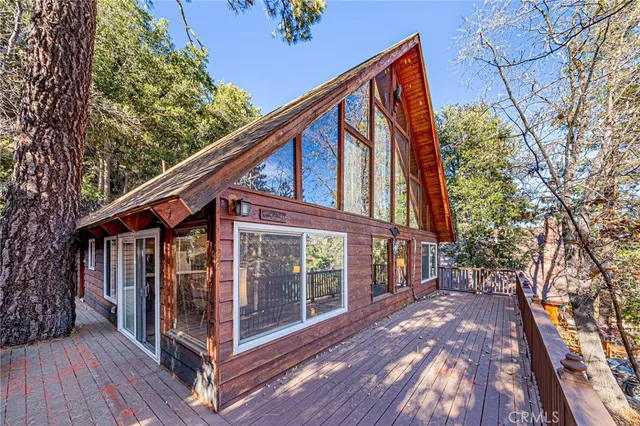 a view of balcony with wooden floor and fence
