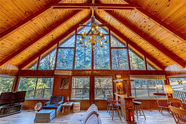 a view of a room with wooden floor
