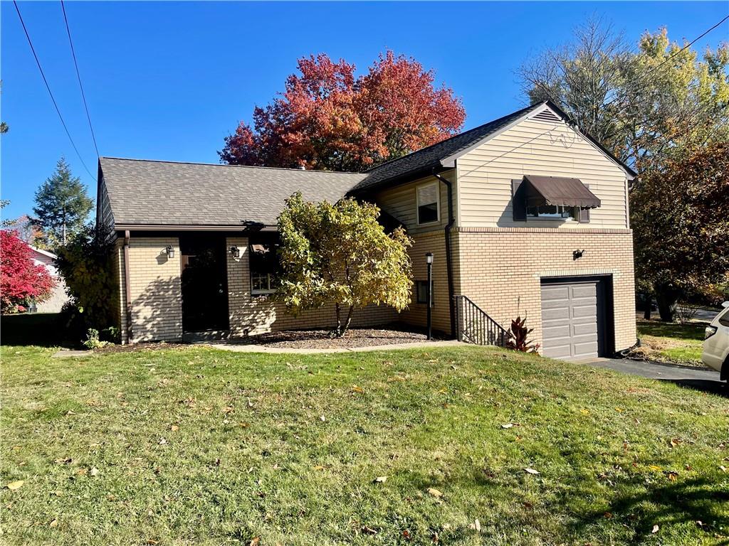 130 Bradys Ridge Road Beaver, PA 15009 - Photo 21 of 22 a front view of a house with a garden and yard