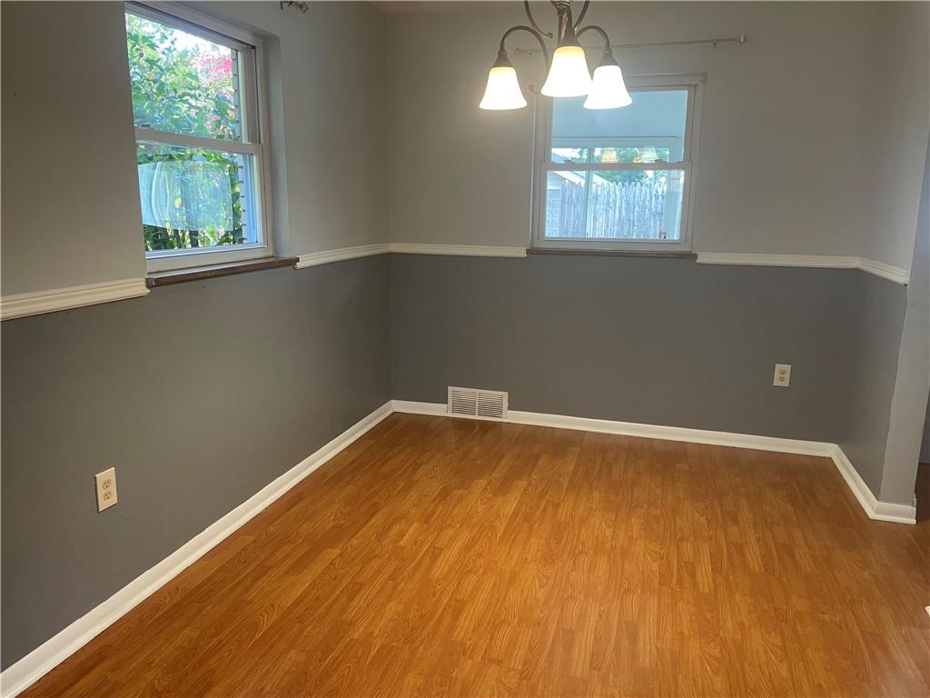 130 Bradys Ridge Road Beaver, PA 15009 - Photo 4 of 22 a view of a room with wooden floor and chandelier