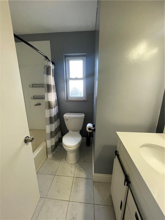 130 Bradys Ridge Road Beaver, PA 15009 - Photo 7 of 22 a bathroom with a sink a toilet and a mirror