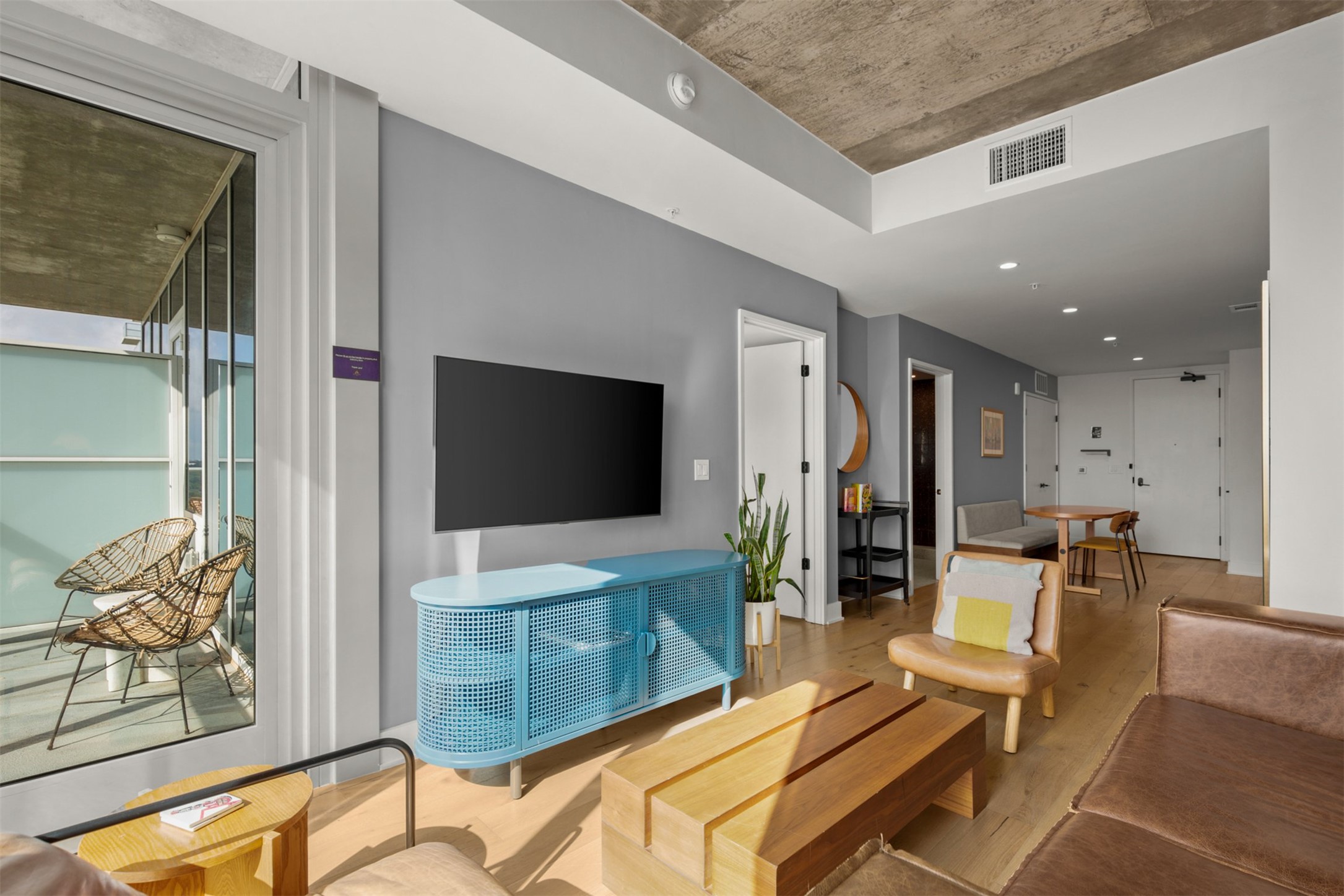 48 East Avenue, Unit 2807 Austin, TX 78701 - Photo 12 of 23 The rich wood flooring runs throughout, grounding the space with its warm, inviting texture and timeless appeal