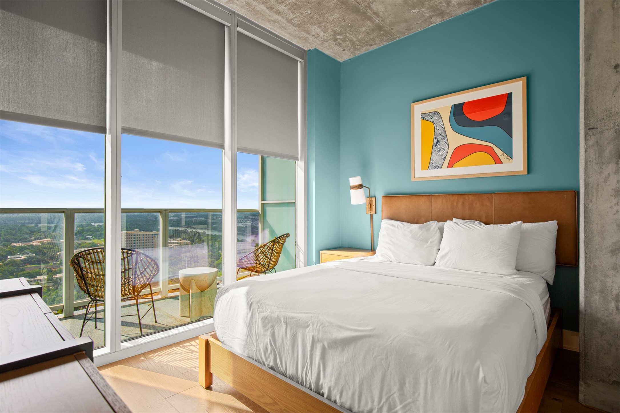 48 East Avenue, Unit 2807 Austin, TX 78701 - Photo 13 of 23 The bedroom offers stunning Lady Bird lake and city views, providing a peaceful retreat with a front-row seat to Austin's vibrant skyline