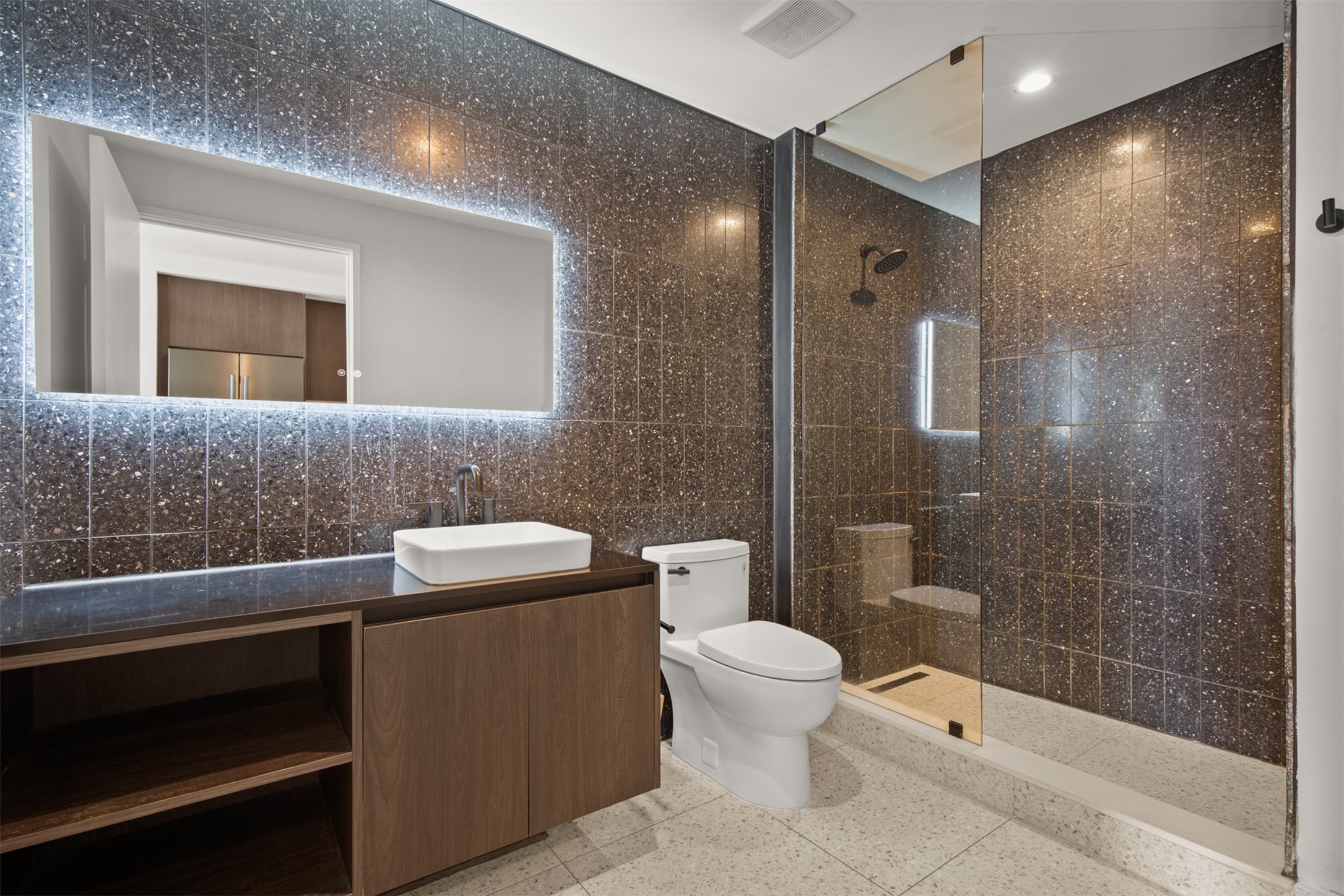 48 East Avenue, Unit 2807 Austin, TX 78701 - Photo 19 of 23 The contemporary, spa-like bath exudes calm with its sleek design, offering a luxurious escape that feels both modern and serene