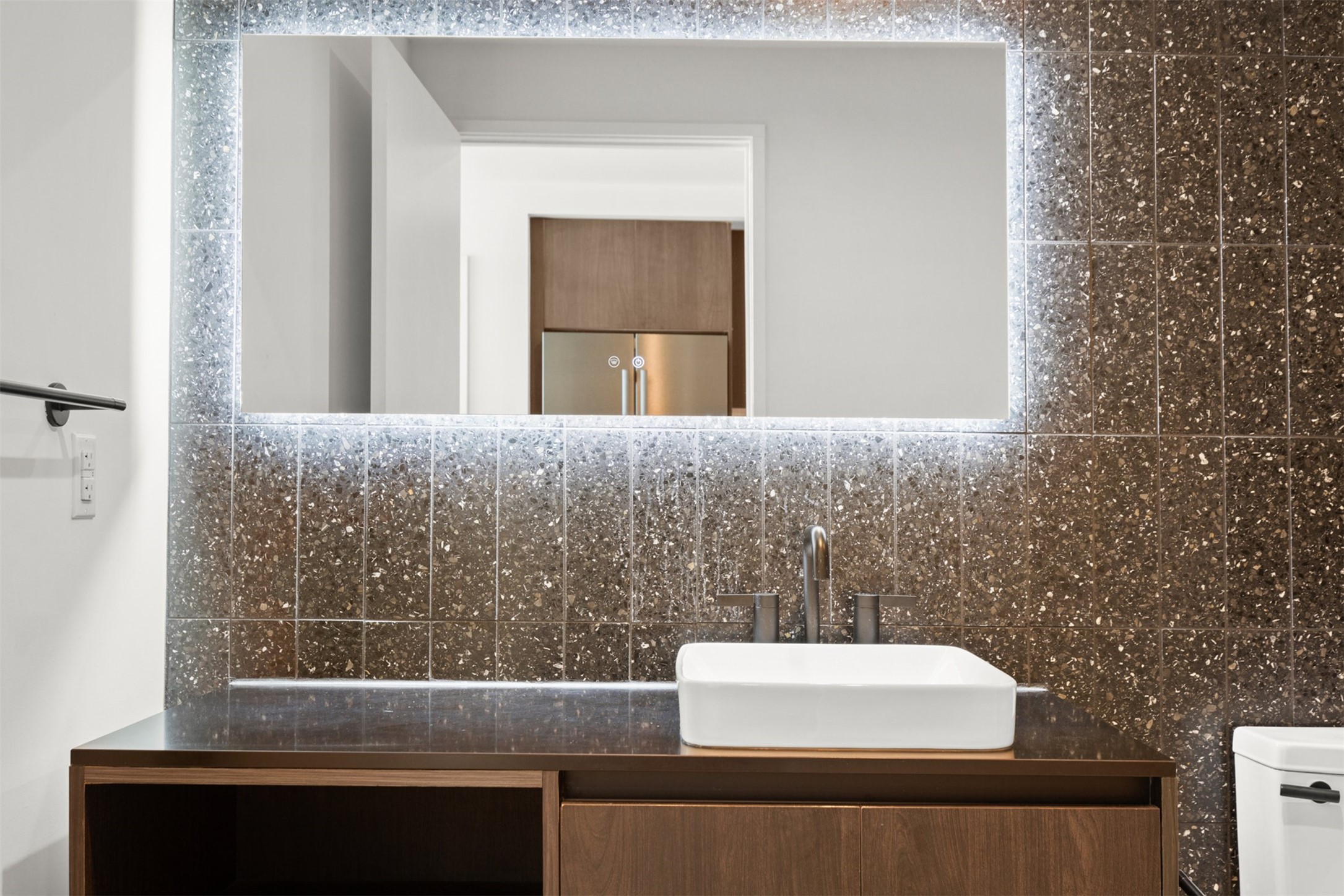 48 East Avenue, Unit 2807 Austin, TX 78701 - Photo 20 of 23 Featuring an oversized single vanity and a spacious walk-in shower, this bath provides the perfect blend of functionality and relaxation