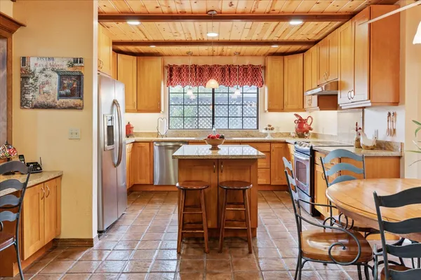 a dining room dining table chairs and a window