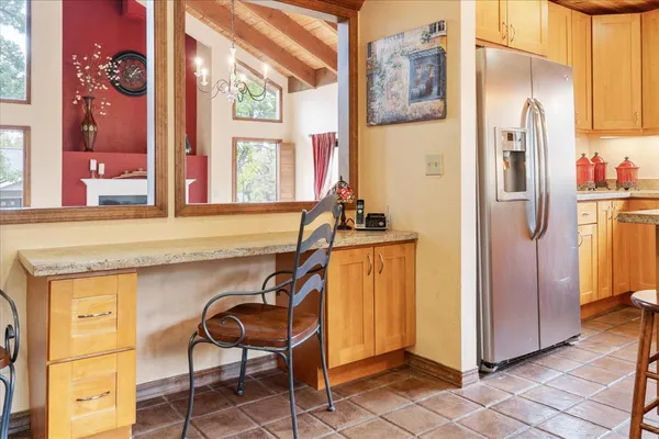 a view of a kitchen with furniture and a window