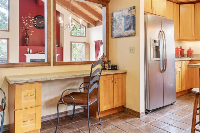 a view of a kitchen with furniture and a window