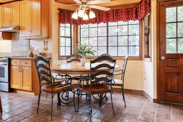 a dining room with furniture and window