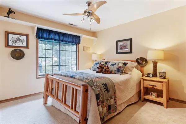 a view of a chairs and table on the wooden floor