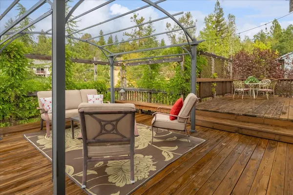 a view of a balcony with wooden floor