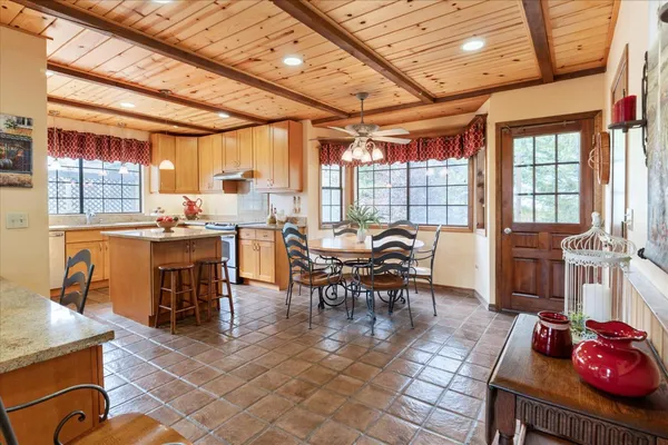 a view of a dining room with furniture window and outside view