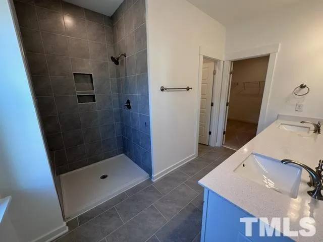 a bathroom with a sink and shower
