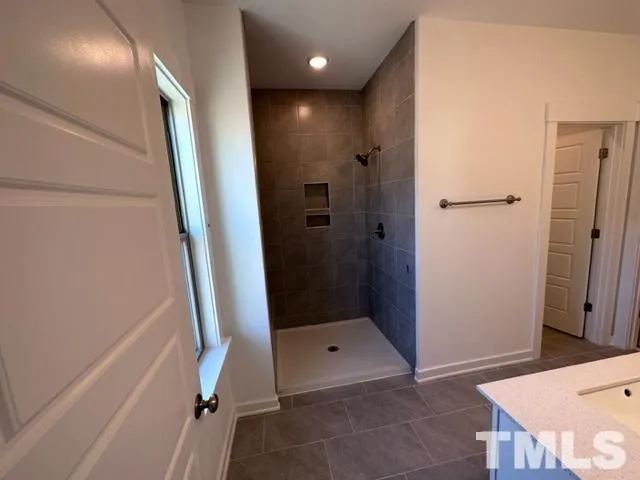 a bathroom with a sink and shower