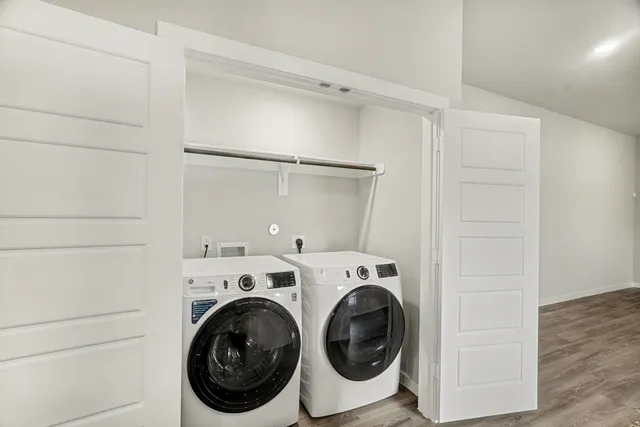 a dining room with furniture and wooden floor