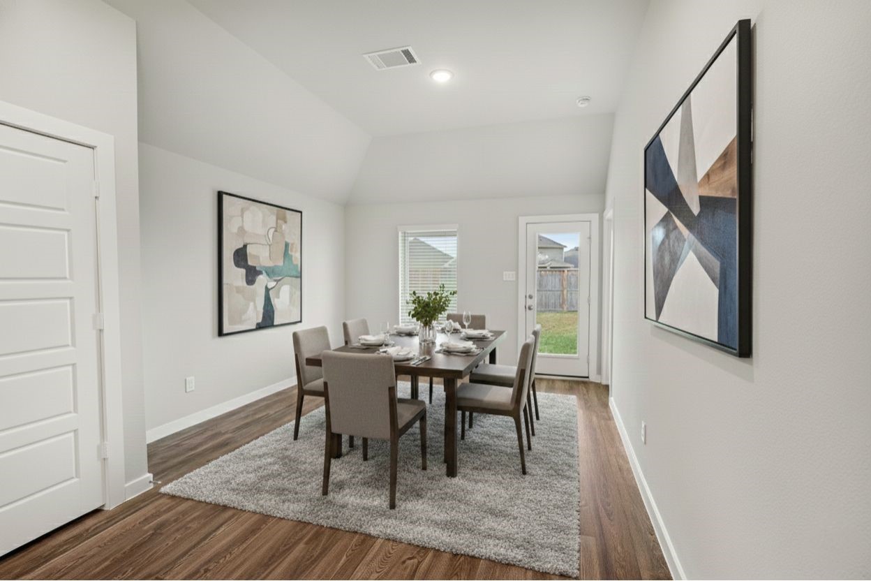 8427 Blue Shell Lane Cypress, TX 77433 - Photo 12 of 27 a dining room with furniture and wooden floor