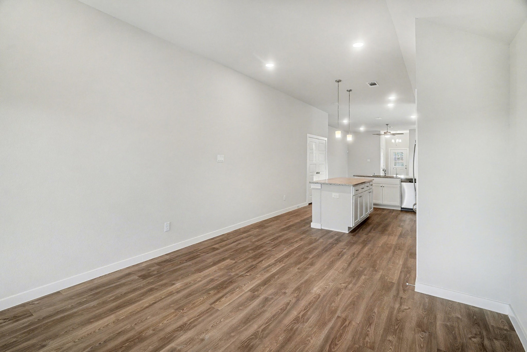 8427 Blue Shell Lane Cypress, TX 77433 - Photo 13 of 27 a view of a kitchen with a sink and wooden floor