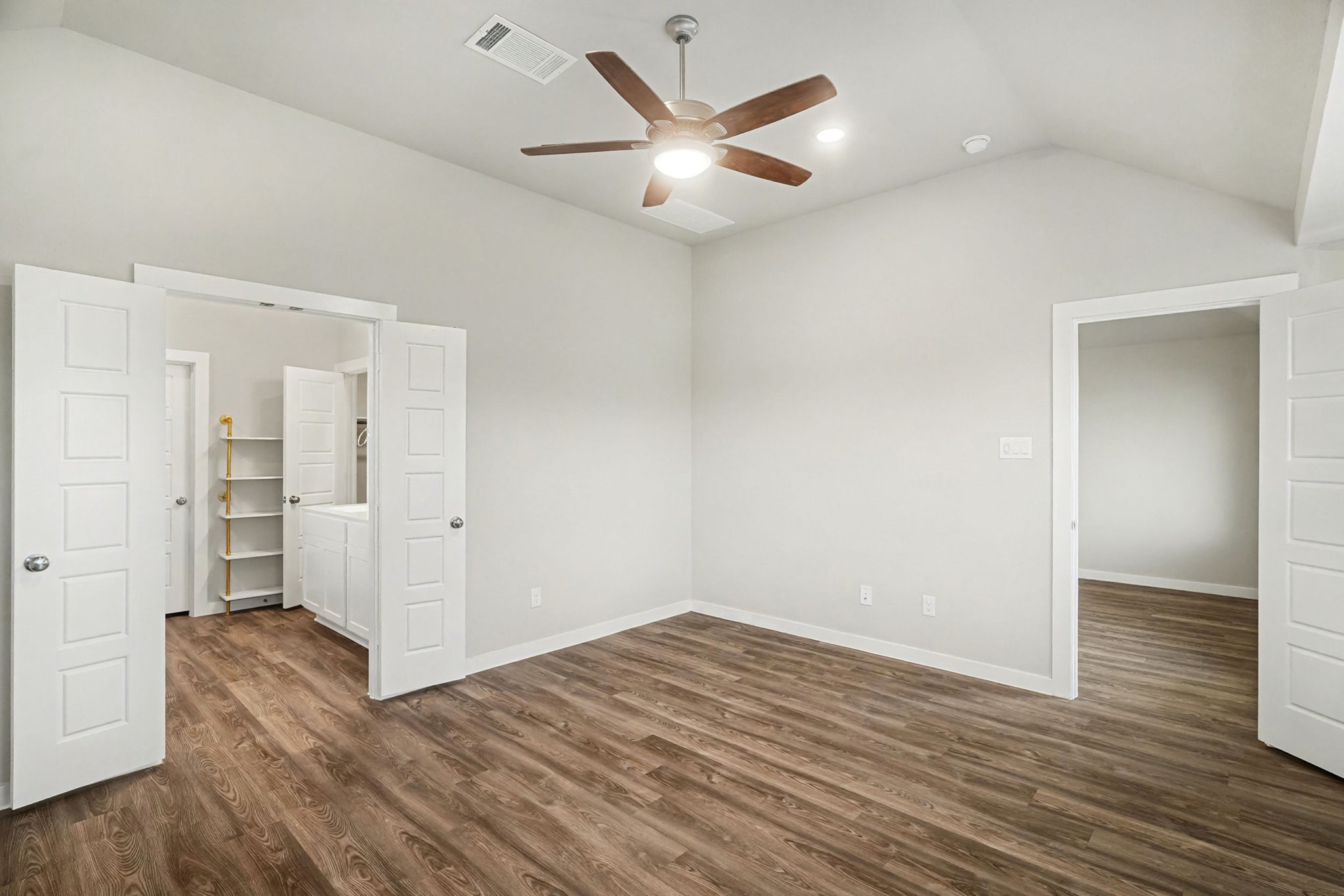 8427 Blue Shell Lane Cypress, TX 77433 - Photo 18 of 27 an empty room with wooden floor and ceiling fan