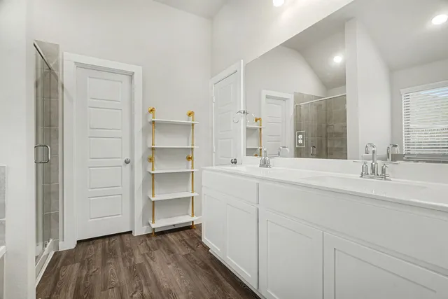 a view of a room with wooden floor