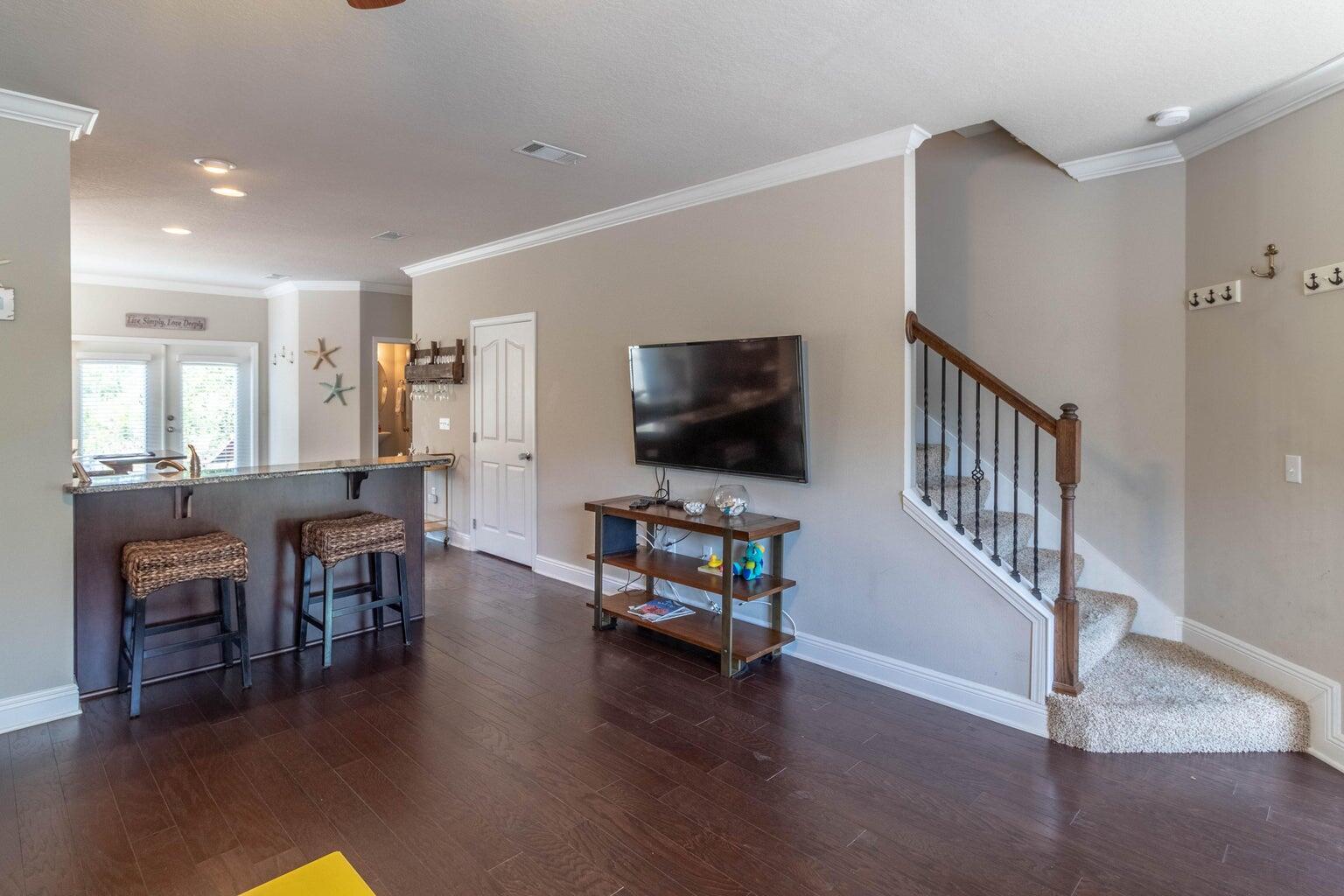 7 Barbados Lane Inlet Beach, FL 32461 - Photo 8 of 15 a living room with furniture and a flat screen tv
