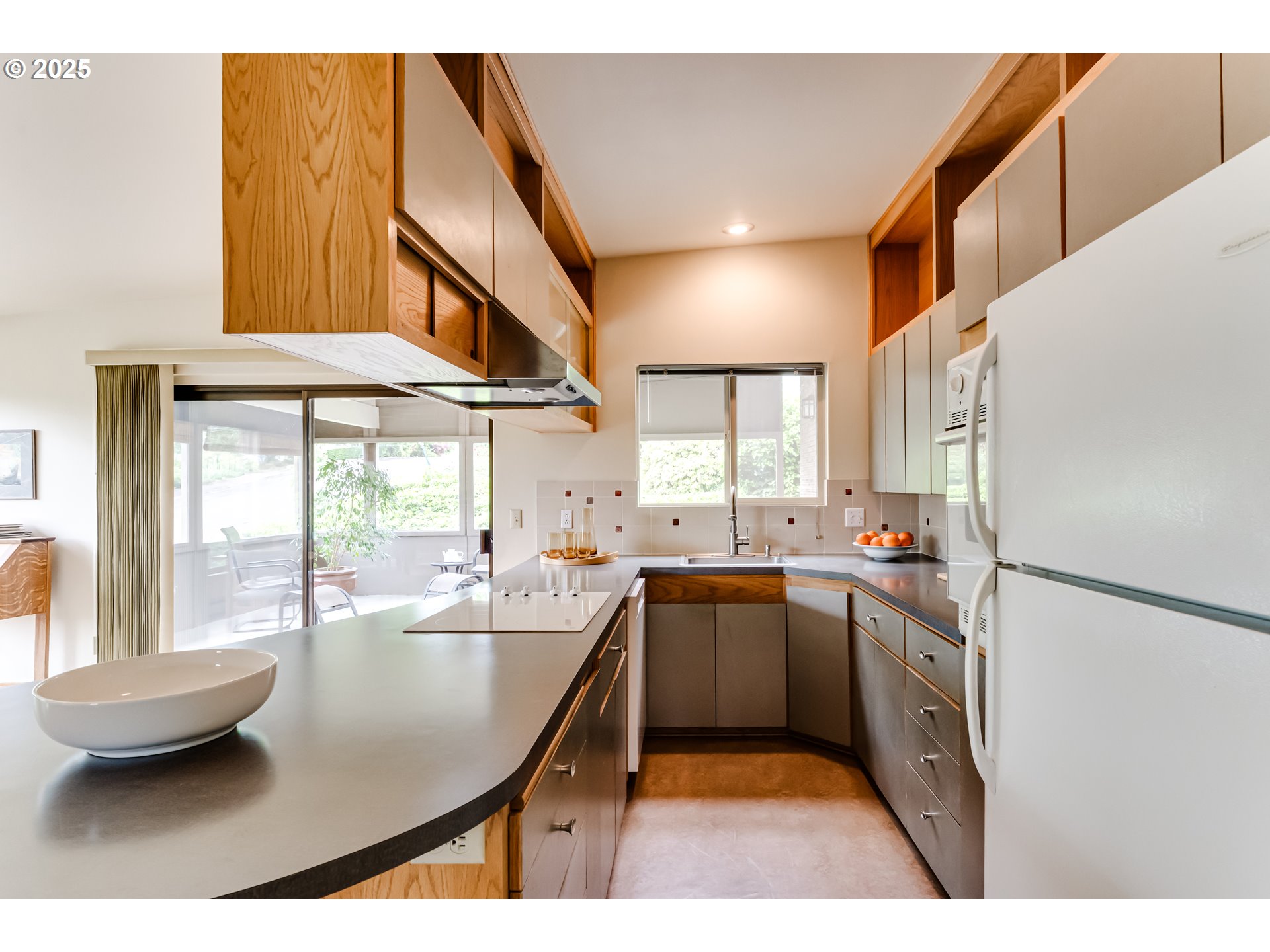 495 West 27th Avenue Eugene, OR 97405 - Photo 11 of 48 a kitchen with stainless steel appliances granite countertop a sink a stove and a refrigerator