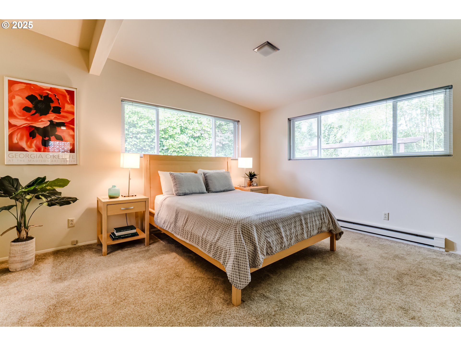 495 West 27th Avenue Eugene, OR 97405 - Photo 15 of 48 a bedroom with a bed and a painting on the wall