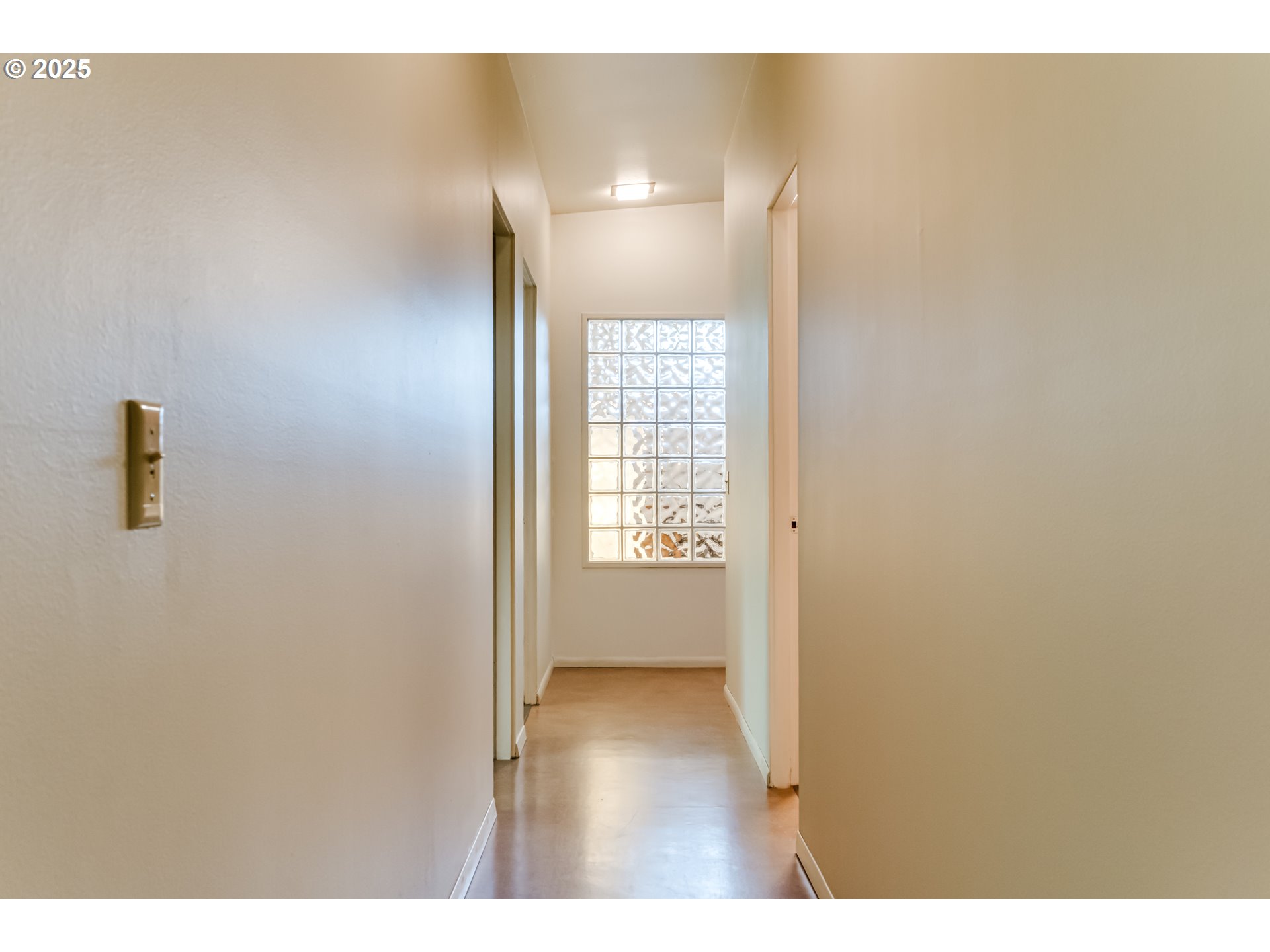 495 West 27th Avenue Eugene, OR 97405 - Photo 26 of 48 a view of an empty room with wooden floor and a window