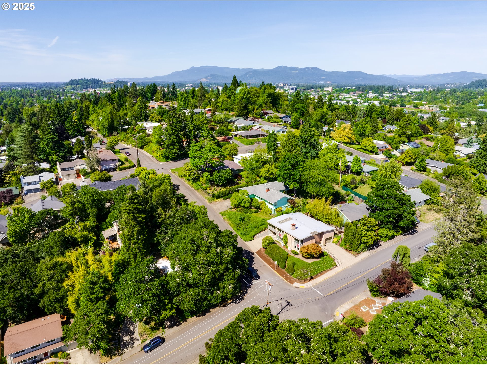 495 West 27th Avenue Eugene, OR 97405 - Photo 4 of 48 an aerial view of a house with a yard