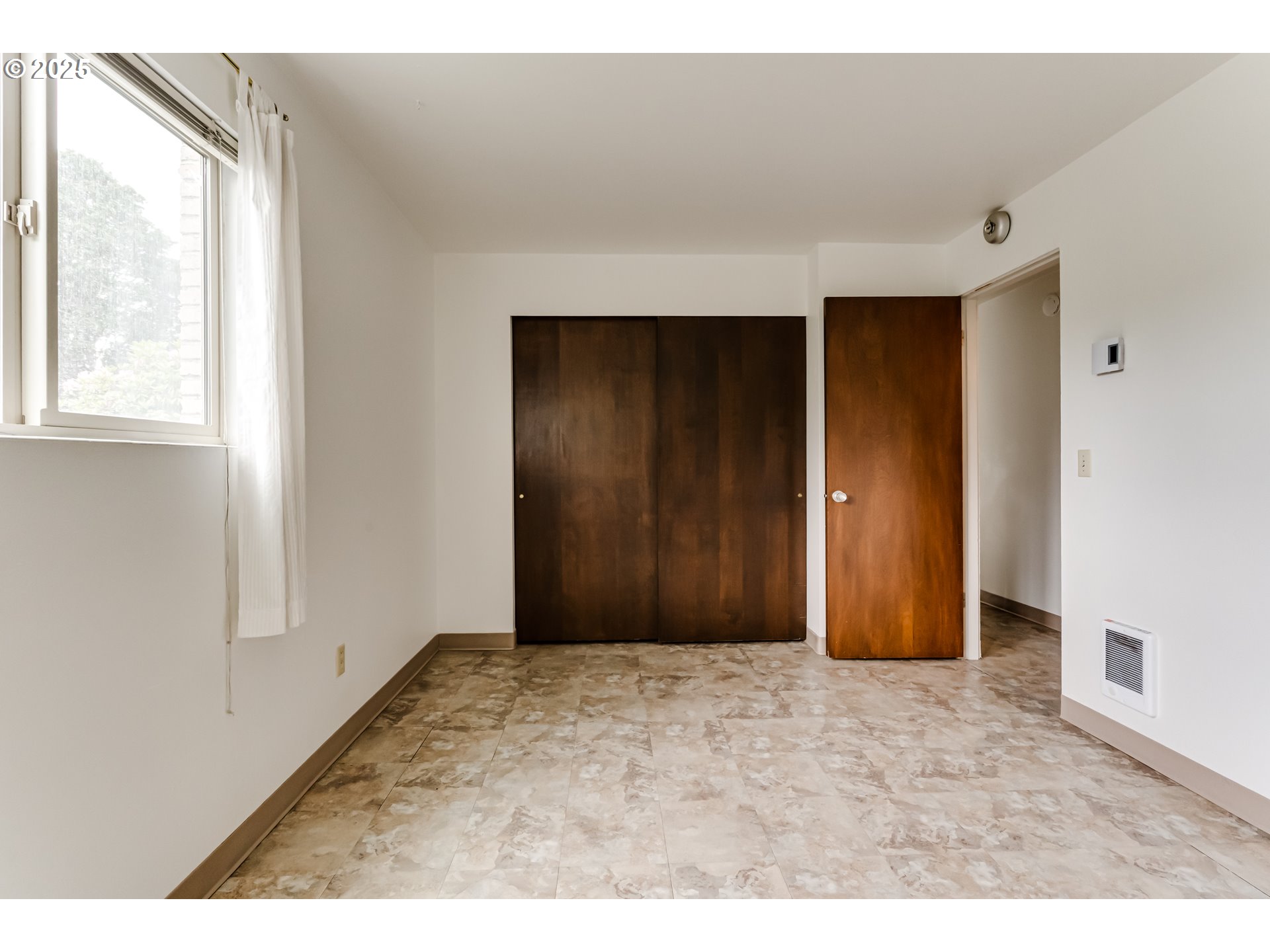 495 West 27th Avenue Eugene, OR 97405 - Photo 41 of 48 a view of an empty room with wooden door