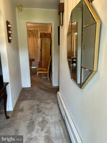 an entryway with a mirror