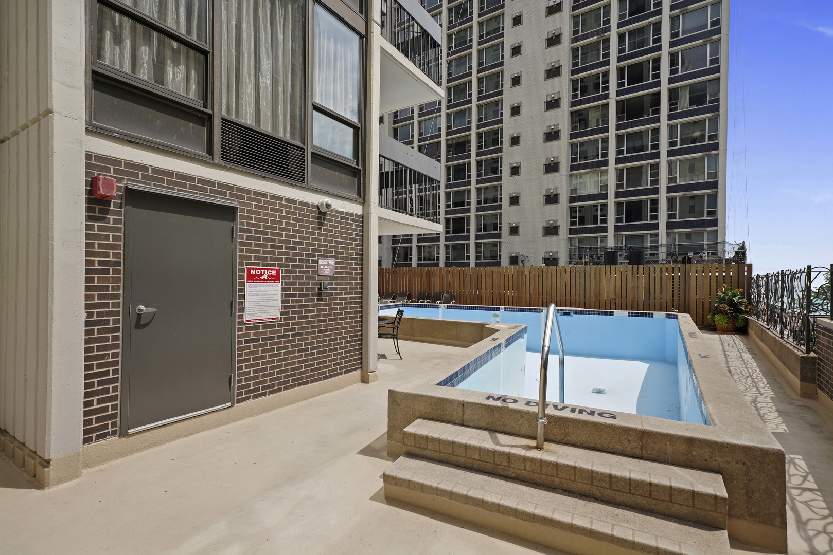 1313 North Ritchie Court, Unit 805 Chicago, IL 60610 - Photo 16 of 21 a view of staircase with a rug and a window