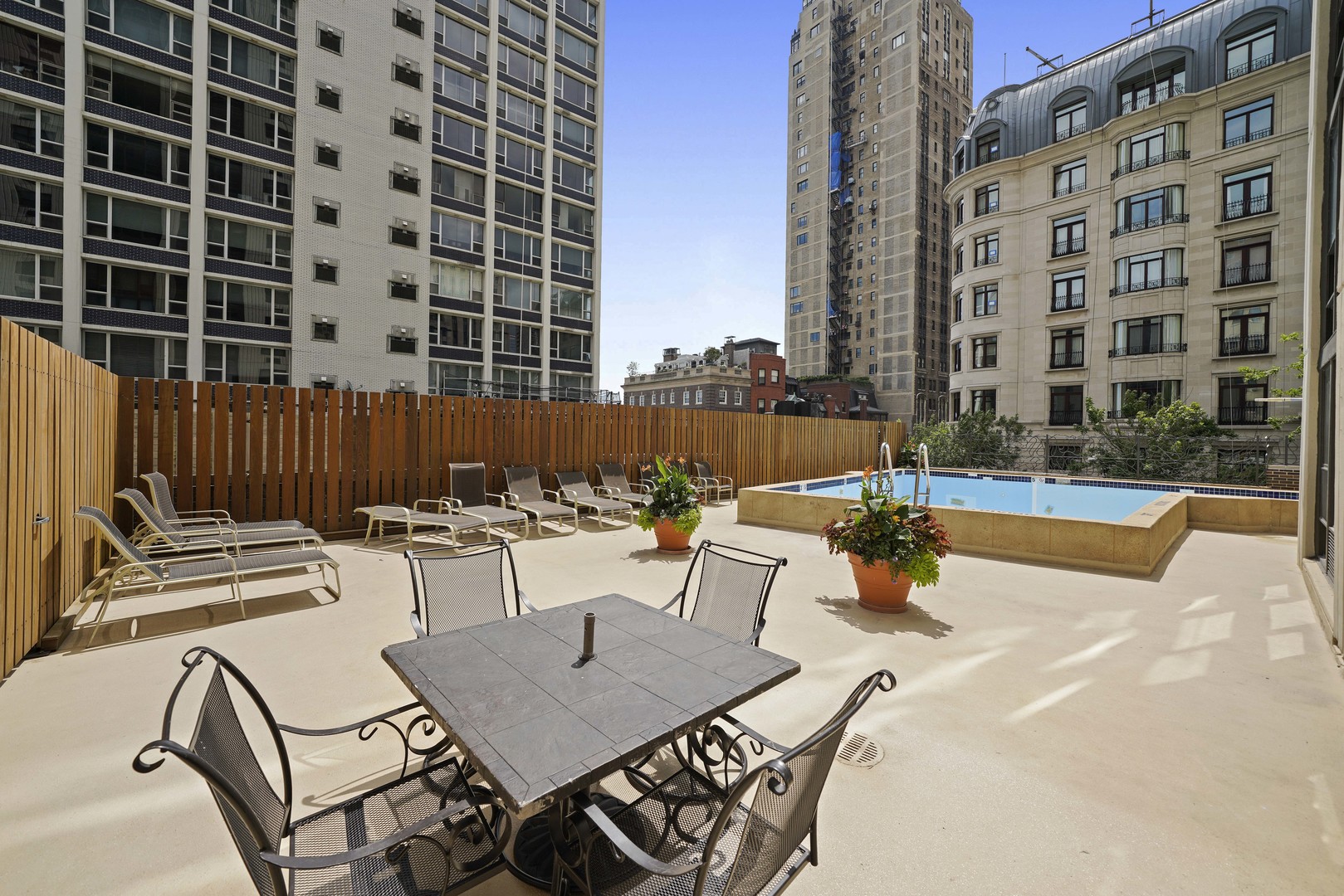 1313 North Ritchie Court, Unit 805 Chicago, IL 60610 - Photo 17 of 21 a view of a patio with a table and chairs