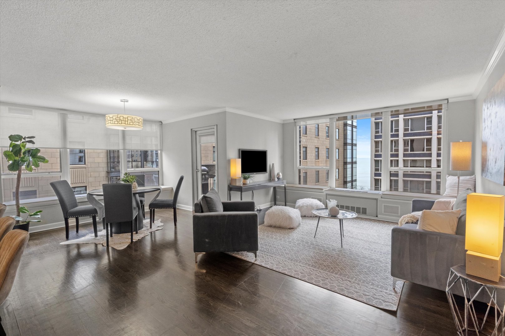1313 North Ritchie Court, Unit 805 Chicago, IL 60610 - Photo 5 of 21 a living room with furniture and a flat screen tv